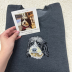 Fluffy Buddy custom embroidered pet portrait sweatshirt made from your photo, showing detailed stitching of a dog portrait on a cozy sweater